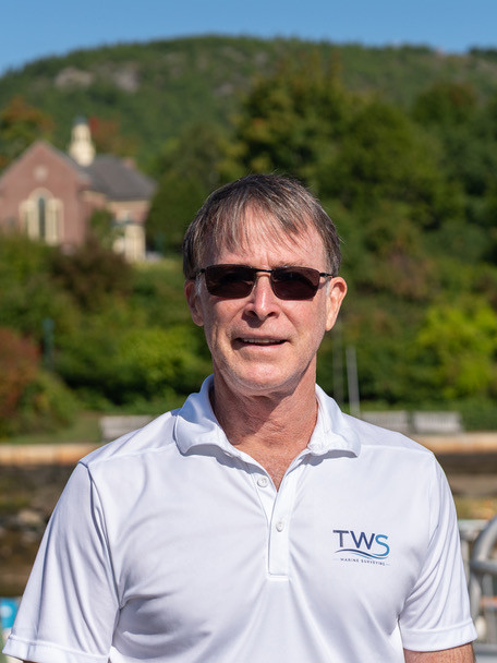 Thomas W. Smith, principal surveyor, in a white TWS Marine Surveying polo shirt.